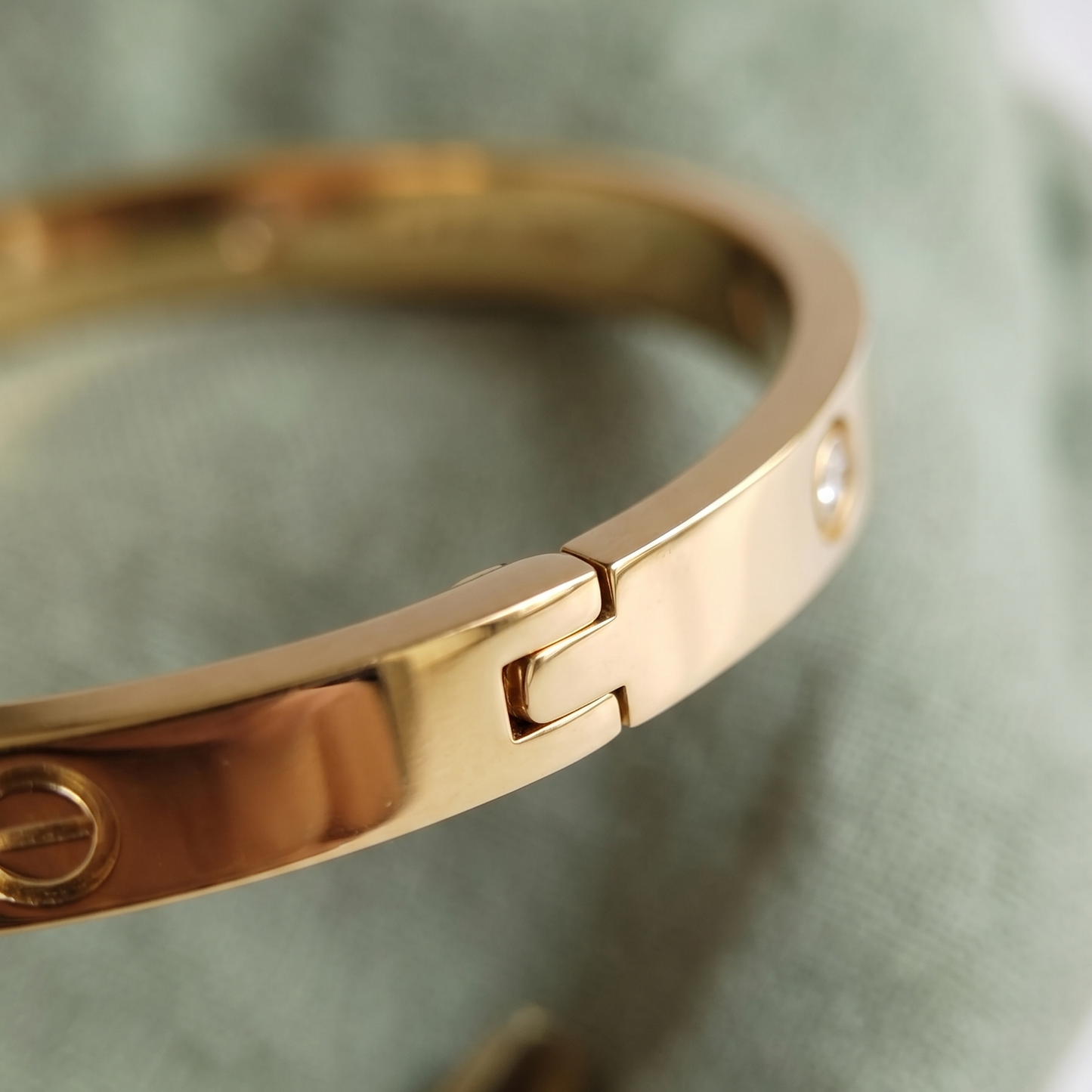 Iconic Gold Bangle with Screw Motifs and Bezel-Set White Stones - SwarnaSage Exclusive